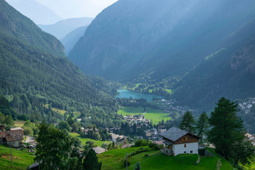 Fototapeta na wymiar village in the mountains with lake