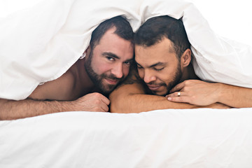 A Handsome gay men couple on bed together