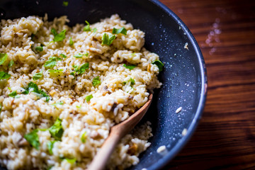 Mushroom Risotto in Iron Pan with Herbs and Parmesan Cheese, Top View