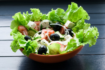 Greek salad with fresh vegetables feta cheese tomatos and black olives. Vegan food. Healthy food.
