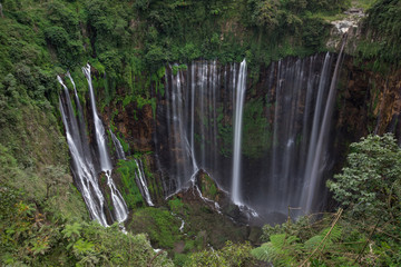 View of the beautiful Coban Sewu waterfall from the lookout in Java, Indonesia