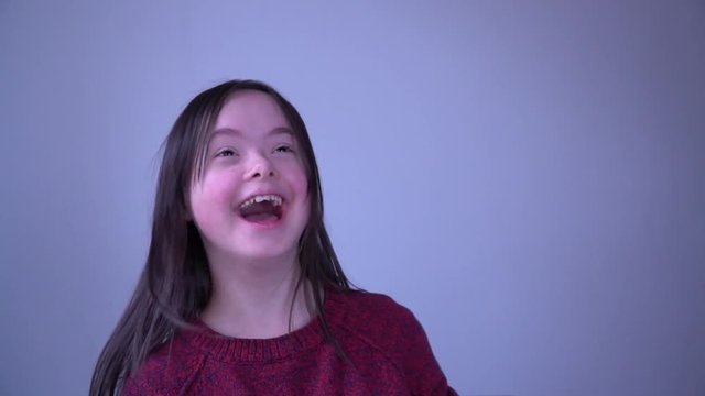 Girl with Down Syndrome have fun with different socks