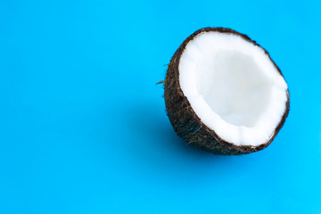Fresh Coconat on a blue background. Minimalism concept. Coconat pop art style.
