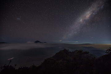 Starry skies and the milky way over the Mount Bromo caldera in East Java, Indonesia