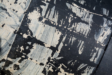 Fototapeta premium white smears on black plastic