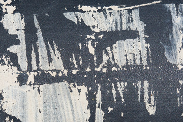 black plastic is carelessly painted in white