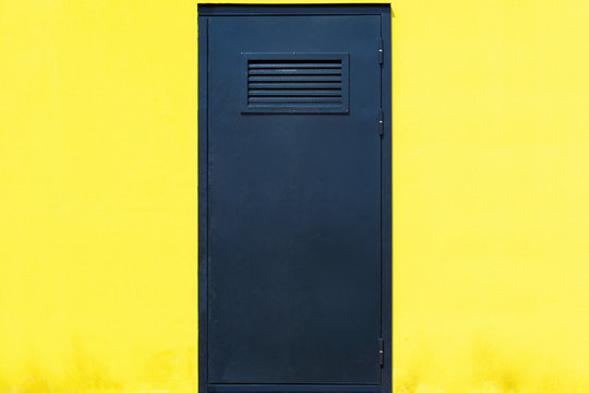 Dark Blue Door On A Yellow Background