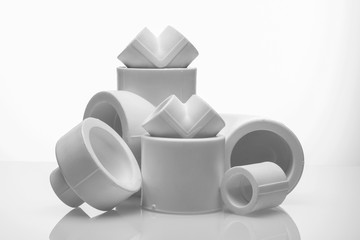 set of fittings for pvc pipes on white background