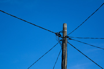 pole with wires on the sky background