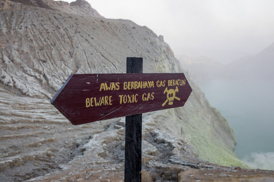 Sign bewaring hikers of the toxic dangers at the sulfur pits within the crater of the Mount Ijen volcano in East Java, Indonesia