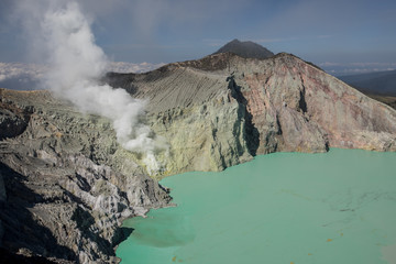 Sulfur mines smoking at the active Mount Ijen volcano in East Java, Indonesia