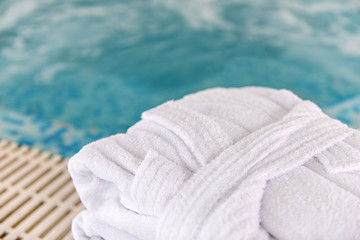 Fototapeta na wymiar Barhrobe next hotel spa swiming pool, spa concept