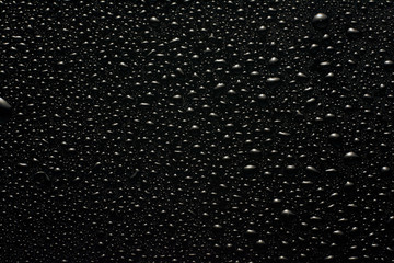 drops of water on a black glass