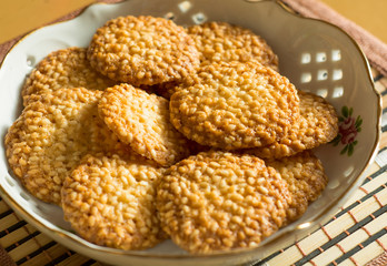 round biscuits with sesame seeds on a plate