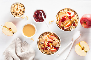 apple peanut butter quinoa bowl with jam and cashew for healthy breakfast