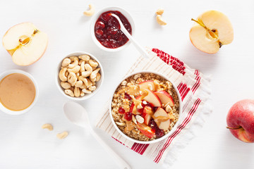 apple peanut butter quinoa bowl with jam and cashew for healthy breakfast