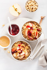 apple peanut butter quinoa bowl with jam and cashew for healthy breakfast