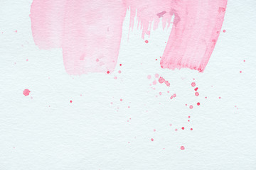 abstract texture with pink watercolor strokes and splatters
