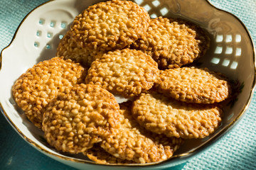 round biscuits with sesame seeds on a plate
