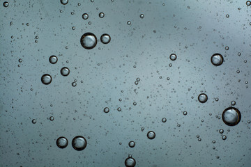 air bubbles in the water. abstract light gray background