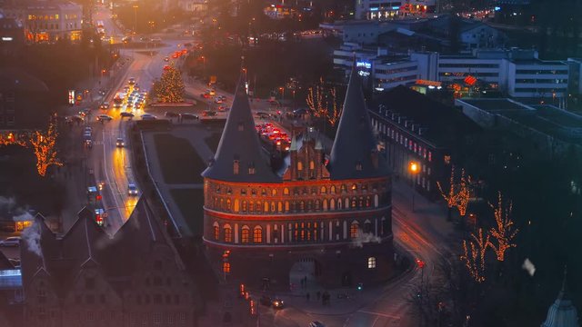 Snowy city at christmas. Holstentor City Gate at night. Lubeck. Germany