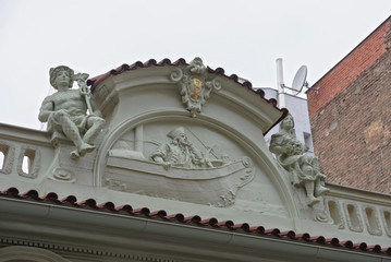 Obraz premium Close-up decorative pediment of old building in Prague, Czech Republic.