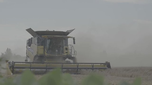 Combine Harvester harvests Barley - Slowmotion - Log Color
