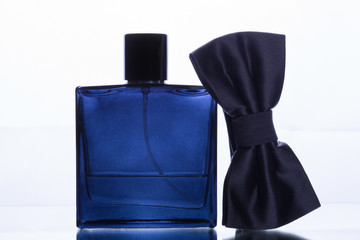 perfume bottle and bow tie