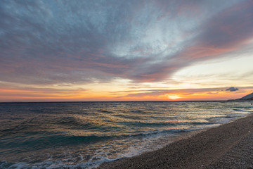 Naklejka na ściany i meble Colorful sunset over the sea. Beautiful landscape