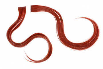 a strand of red hair on a white background, isolated