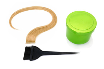 a strand of blond hair as a question mark, brush and container with hair dye on a white background, isolated