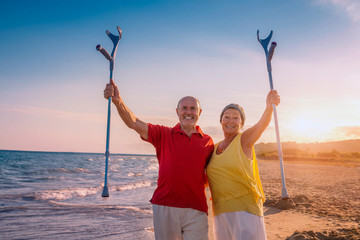 old senior couple fit on summer beach