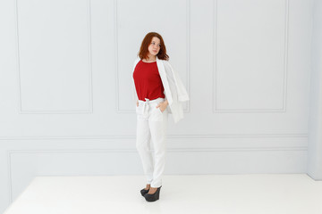 Fototapeta na wymiar Fashion portrait of woman in white suit