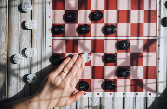 Man in a losing situation. Don't give up concept. Checkers game.
