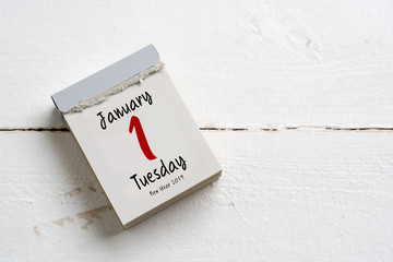 tear-off calendar with 1st of january 2019 on white wooden background