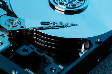 Disassembled hard drive from the computer, hdd with mirror effect. Opened hard drive from the...