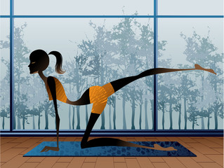 Side view of young woman doing yoga