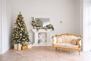 Christmas decor in studio of a classic style living room with a vintage armchair, fireplace, Christmas tree. New Year's interior