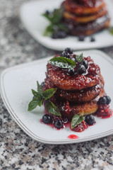 Cottage cheese pancakes, syrniki, curd fritters with fresh berries on white background