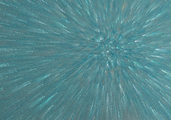 The blue-green glow in the center of gravity spreads out of the