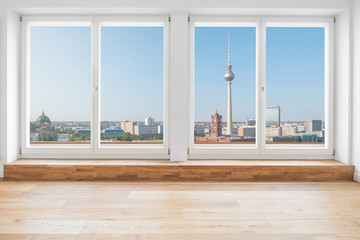 view on Berlin skyline and tv tower through  terrace window in modern apartment room