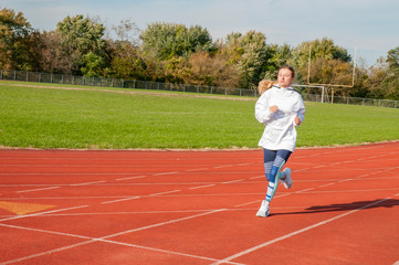 Healthy lifestyle young fitness woman running at outside