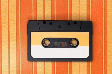 Old audio cassette isolated on white background