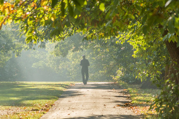 man walking in the park at autumn