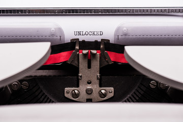 Unlocked text on retro typewriter