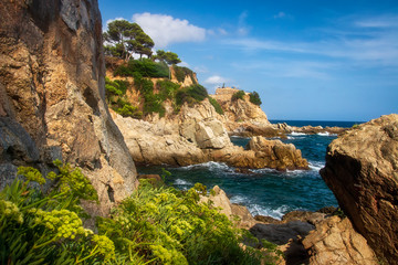 Fototapeta na wymiar Seascape with rocky beach in Lloret de Mar, Costa brava, Spain