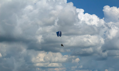 paraglider in the blue sky