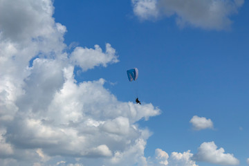 paraglider in the blue sky