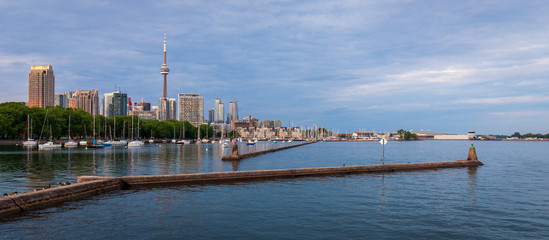 Piers in Toronto Harbourfont with Boats and Skyline 