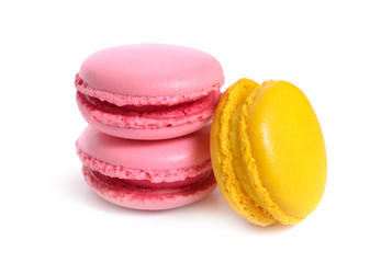 A macaron or French macaroon. Small present with yellow and pink. Isolated